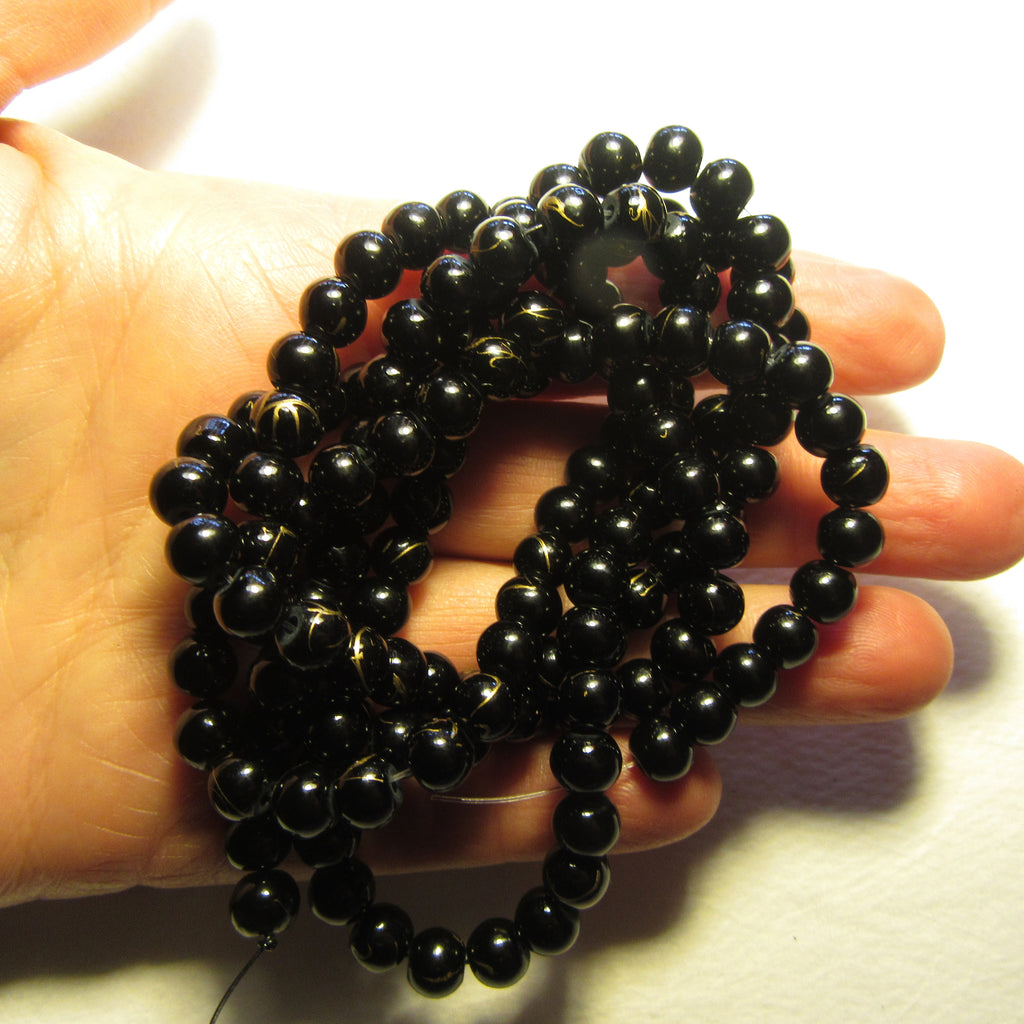 Black glass beads with Gold Vein